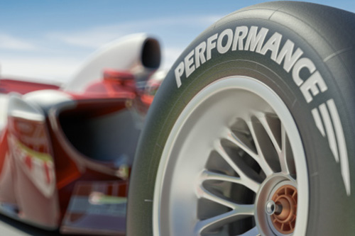 A close-up on one wheel of a Formula One race car.