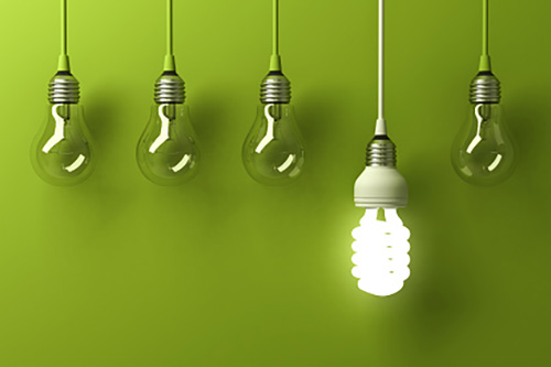 Image showing several lightbulbs that are incandescent, and one that is a power-saving fluorescent.