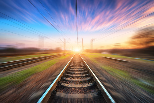 View of parallel train tracks being traversed at speed